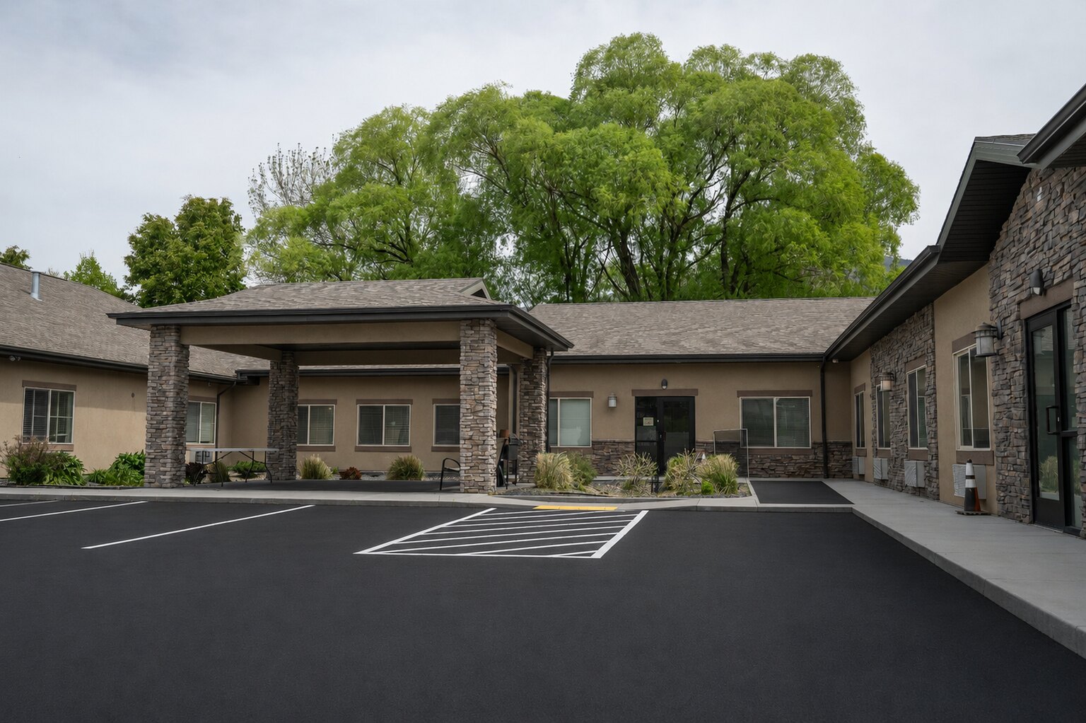 Fresh asphalt and exterior rooms at Pheasant View Assisted Living